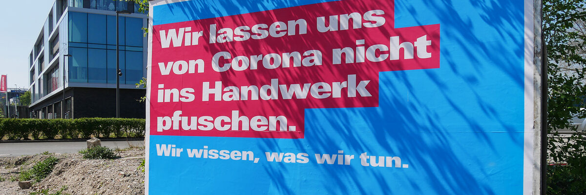 Ein Plakat von der Handwerkskammer Bielefeld zum Thema Corona am Campus. 